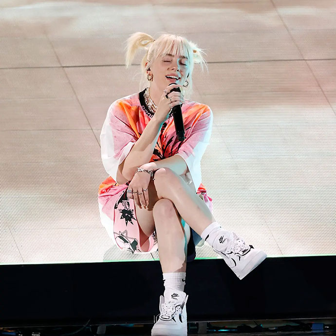 OWC Billie Eilish sitting on stage